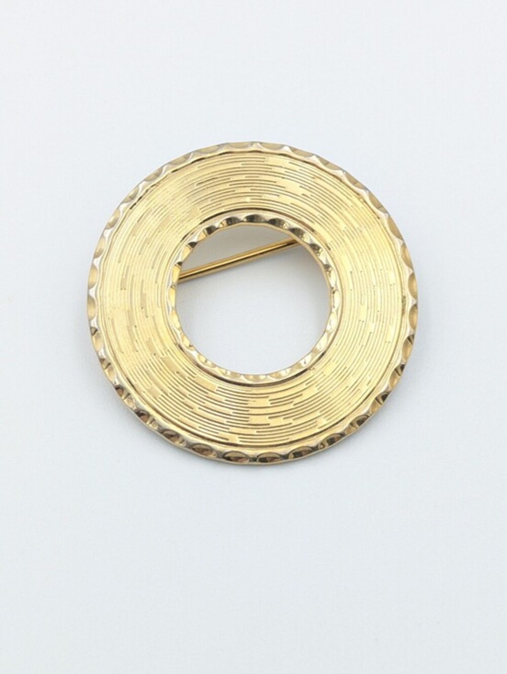 Vintage gold tone round textured open center brooch pin